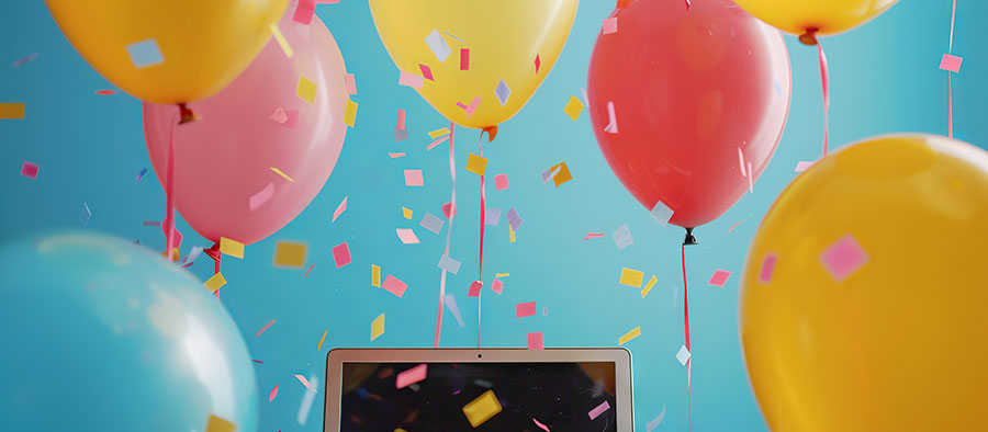 Festive laptop surrounded by colorful balloons and confetti celebrating the 10 best association websites