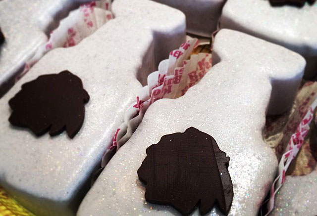 A closeup of several cookies decorated to resemble the NHL's Stanley Cup trophy.